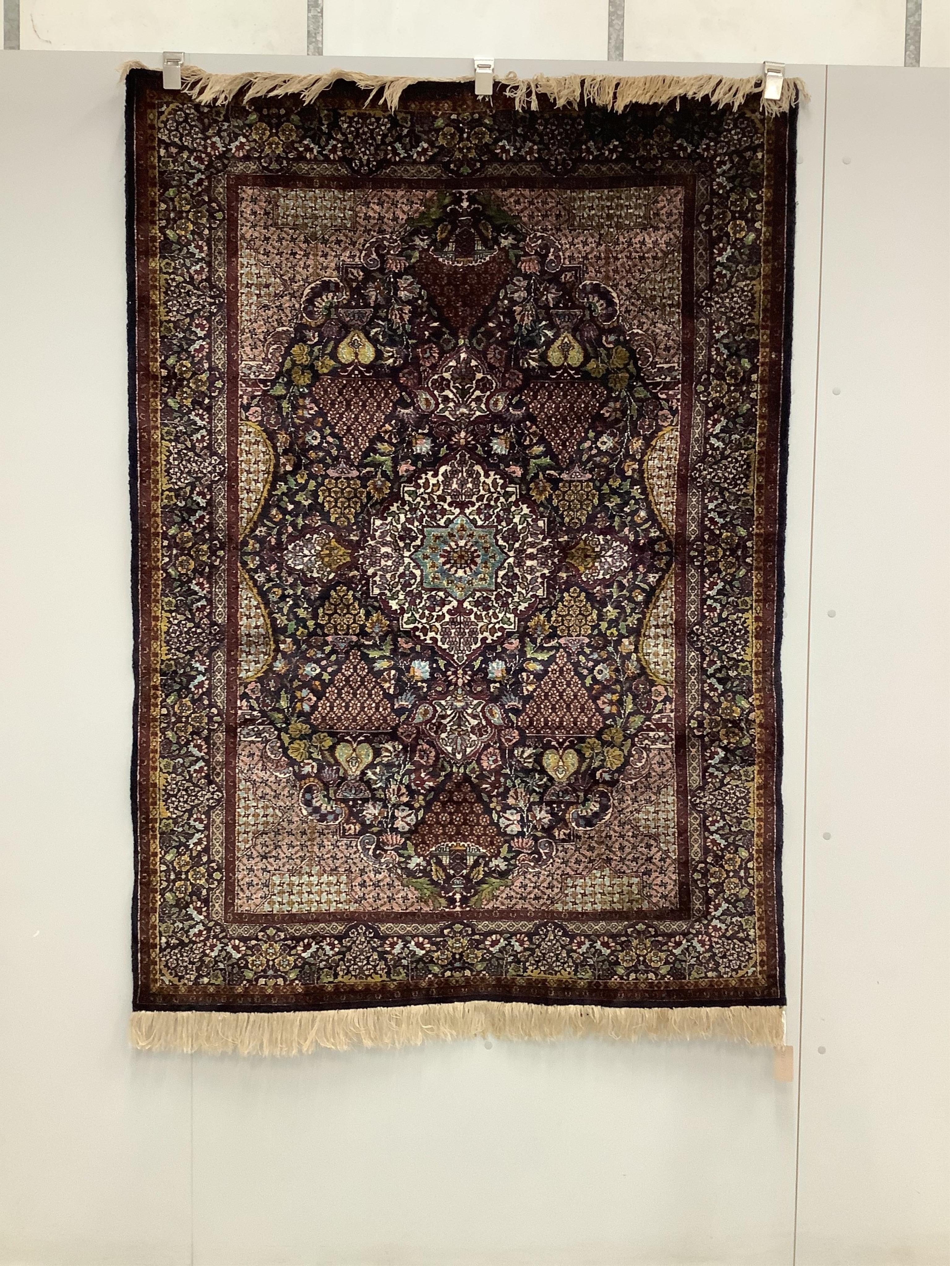 An Isphahan part silk black ground rug, 180 x 136cm. Condition - fair